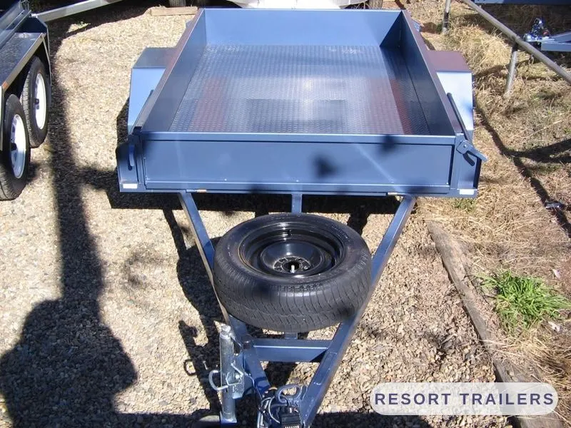 Blue box trailer with the spare wheel under the drawbar — built by Resort Trailers