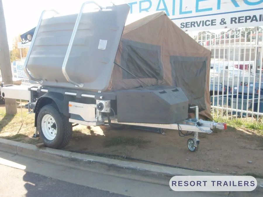 Camper trailer folded down for towing — built by Resort Trailers