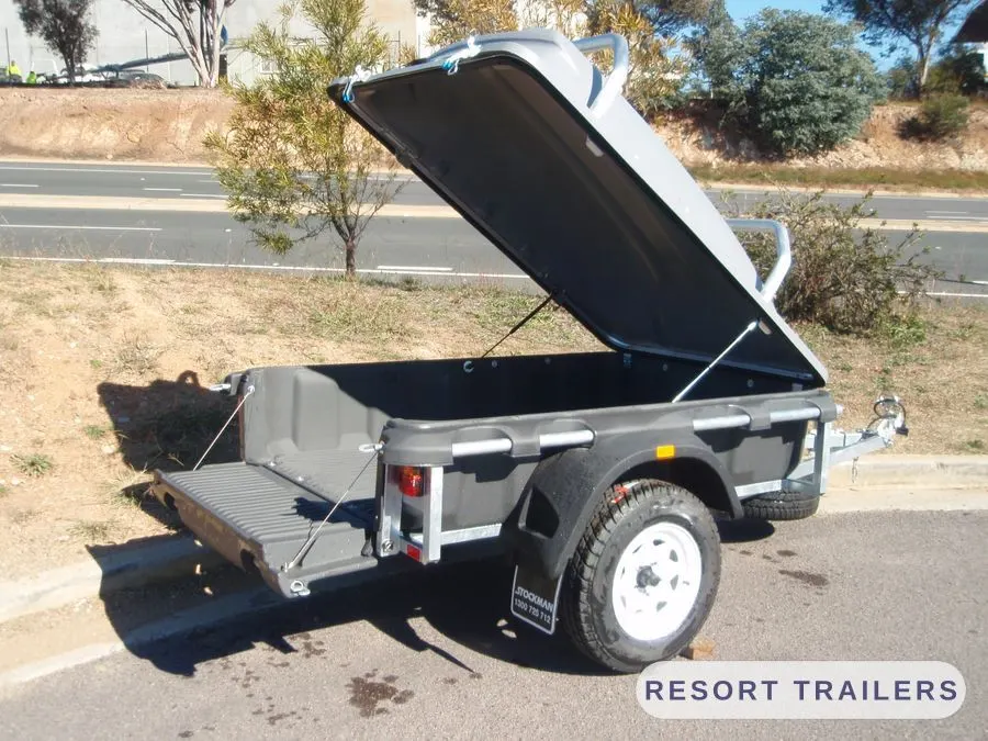 Rear view of the pod camper with the lid open — built by Resort Trailers