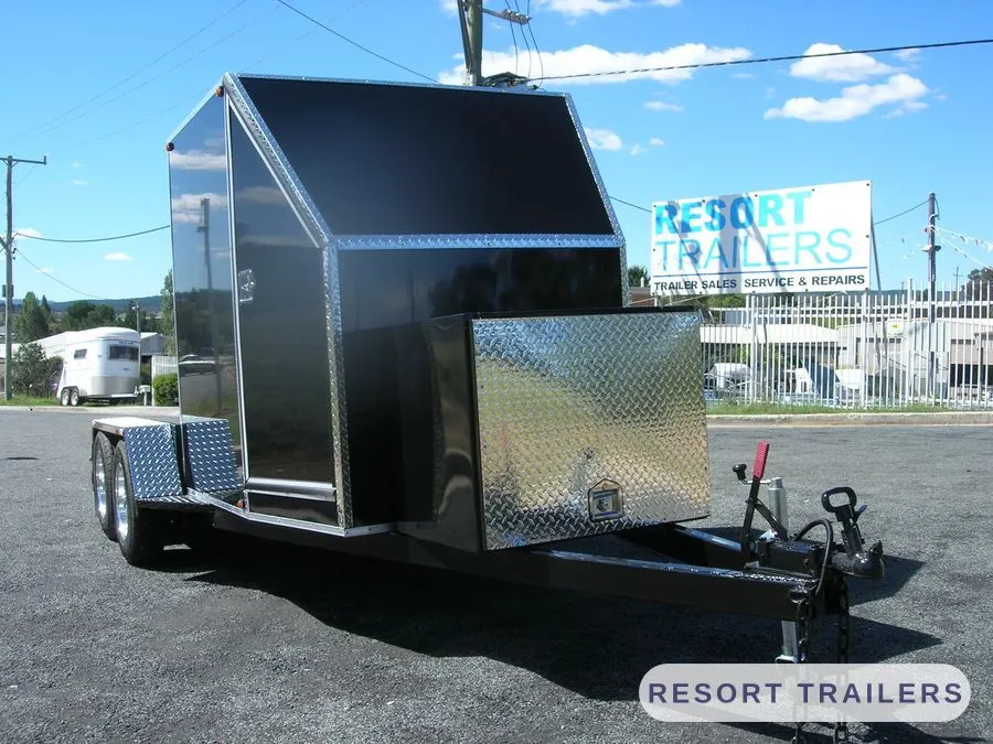Black enclosed car trailer with polished alloy trim — built by Resort Trailers