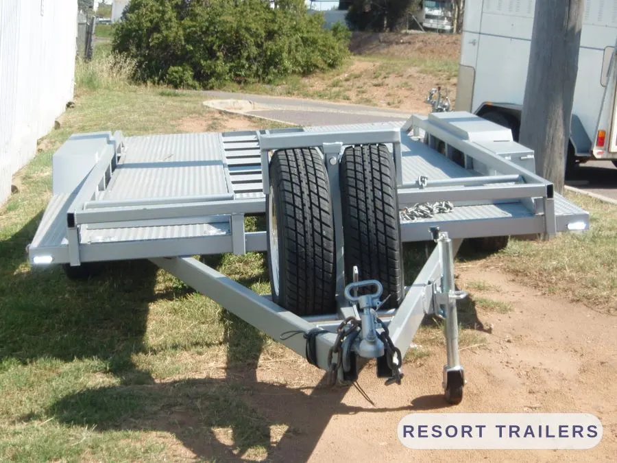 Car float with slide-out ramps and twin spare wheels — built by Resort Trailers