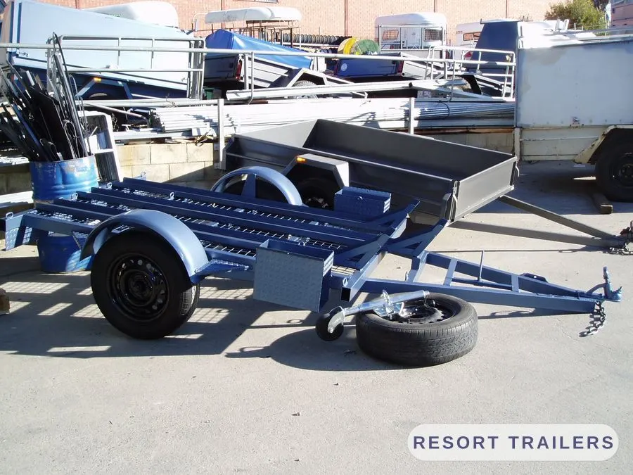 Three-bike motorcycle trailer with mesh infill and wheel chocks — built by Resort Trailers