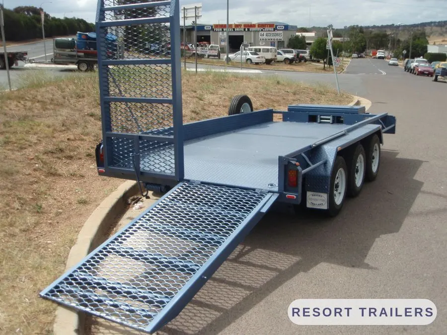 Tri-axle flat float with mesh loading ramp down — built by Resort Trailers