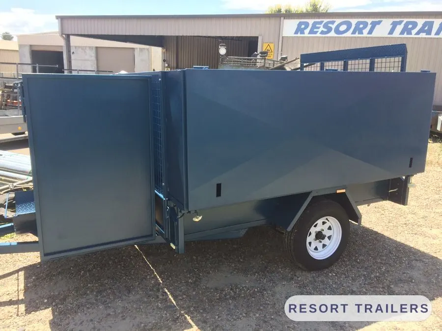 Landscaping trailer with high sides and drop gate — built by Resort Trailers