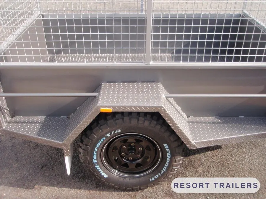 Mud-terrain tyres and galvanised guards on an off-road build — built by Resort Trailers
