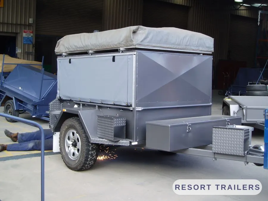 Off-road camper with roof tent and side toolboxes — built by Resort Trailers