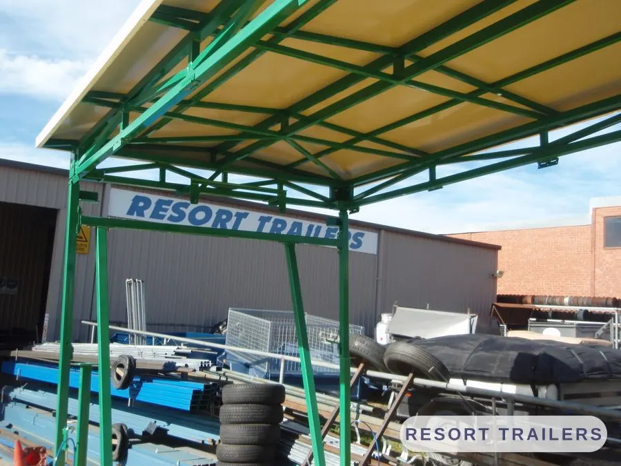 Canopy frame on the carousel trailer, raised — built by Resort Trailers