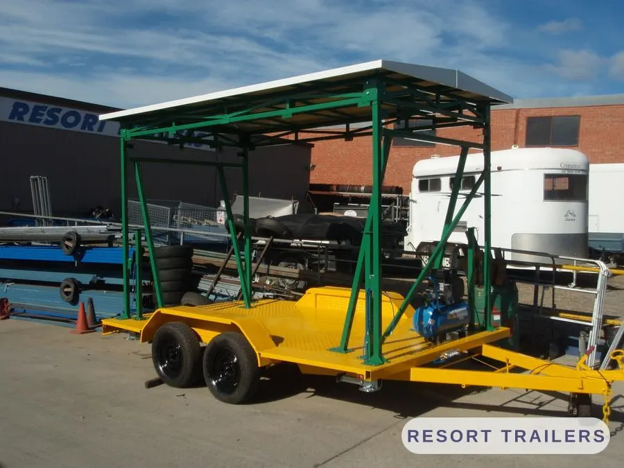 Carousel ride trailer with fold-out canopy frame — built by Resort Trailers