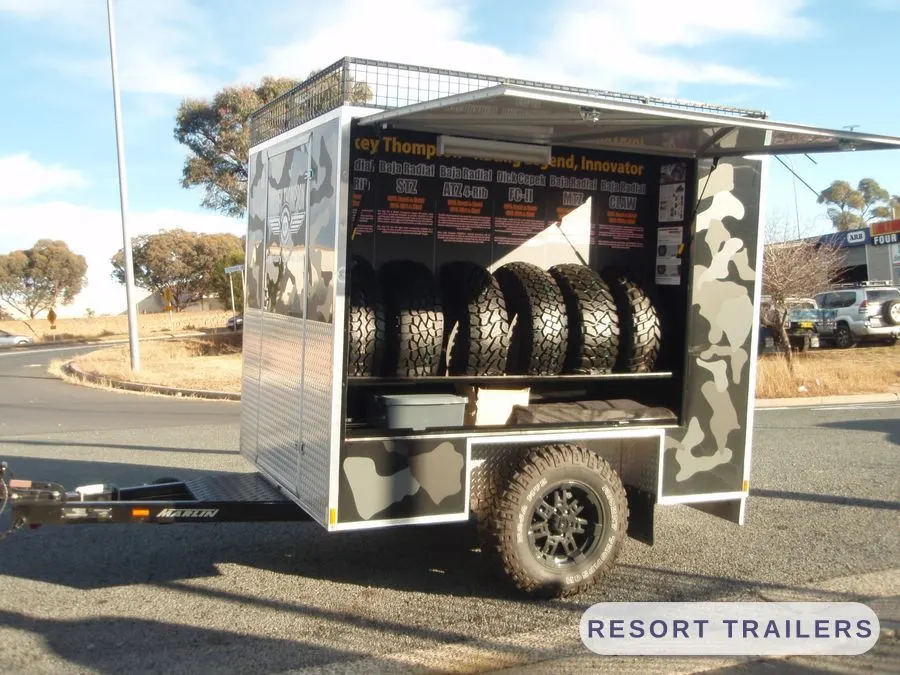 Display trailer with the awning extended at an event — built by Resort Trailers
