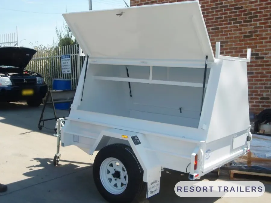 White canopy trailer with both lids raised — built by Resort Trailers