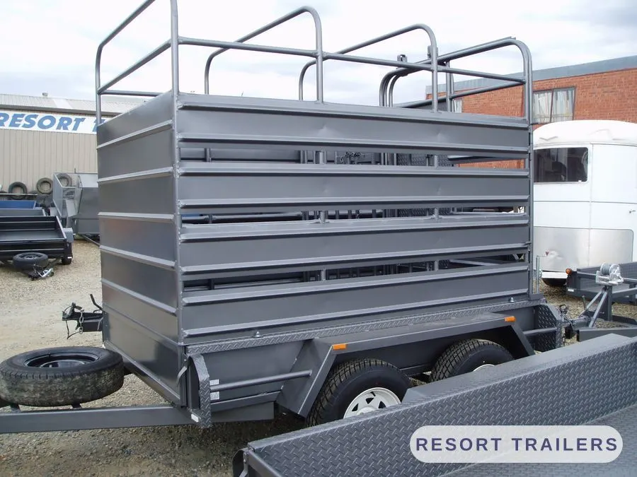 Stock crate with top rails and a checker-plate drawbar — built by Resort Trailers