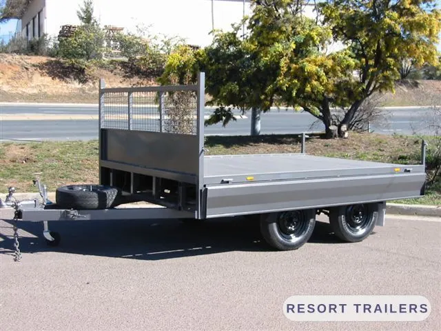 Flat deck with the drop sides folded down — built by Resort Trailers