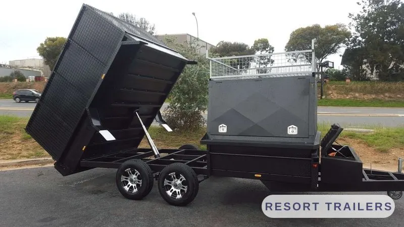 Combo tipping trailer with the body raised — built by Resort Trailers