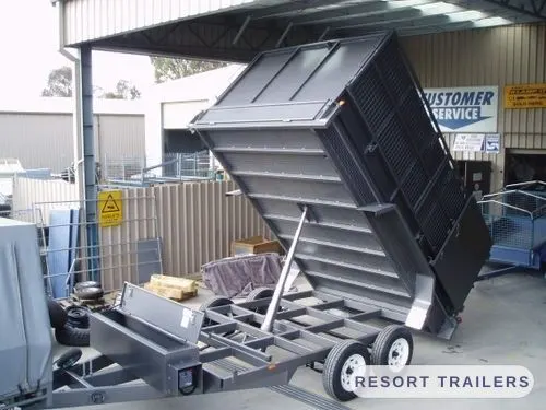 Dual-axle custom tipper with the body fully raised — built by Resort Trailers