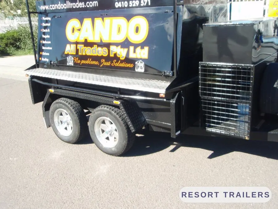 Tradesman trailer with canopy, ladder rack and mesh cage — built by Resort Trailers